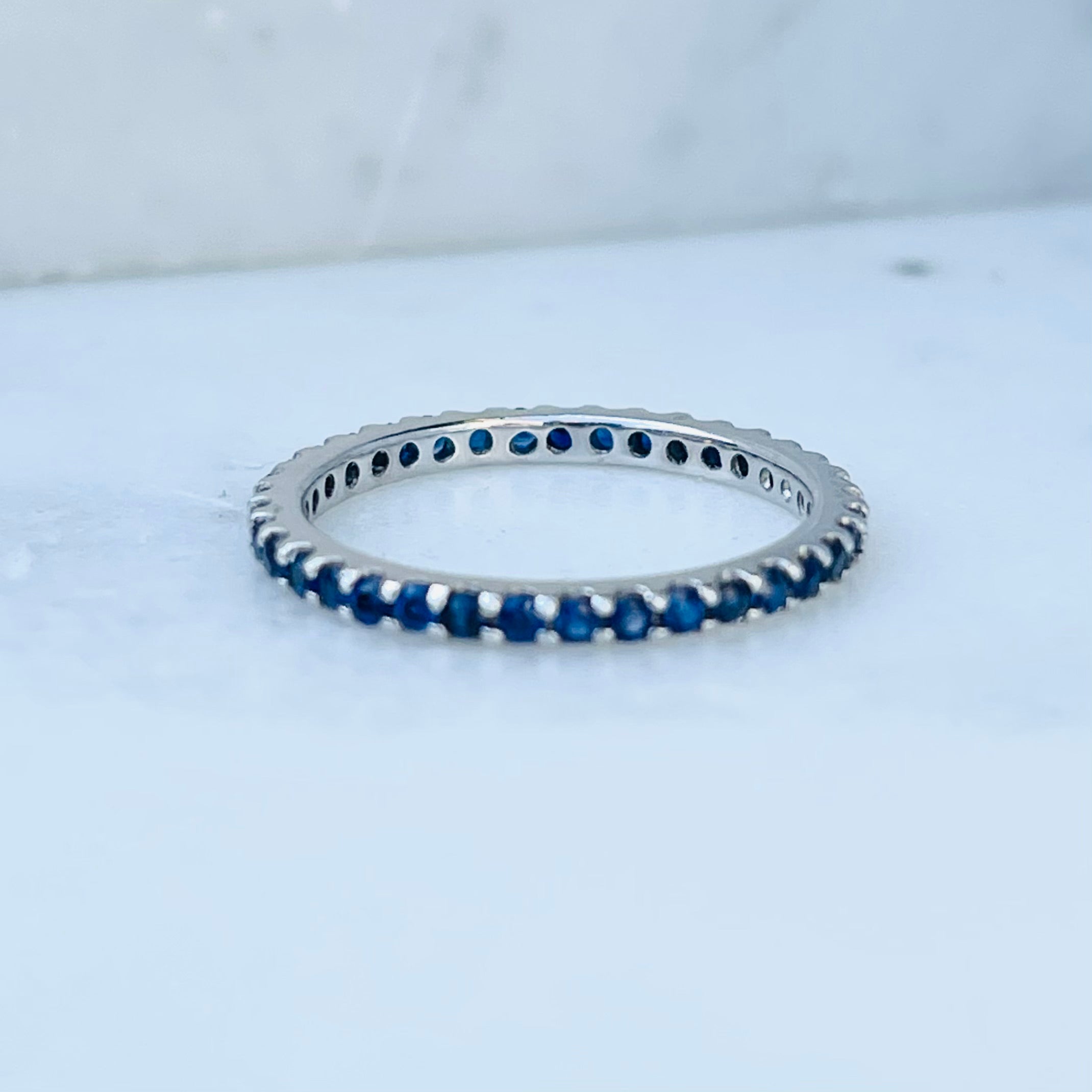 AD121BS Blue Sapphire Shared Prong Eternity Band